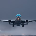 gray and blue airplane in the sky