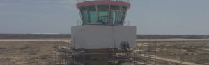 Modern air traffic control tower at Bonaire Airport representing ATM safety case and operational transition support.