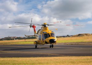 helicopter approaching a heliport during coordinated air traffic management operations.